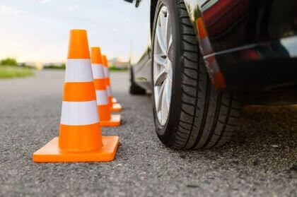 Car and driving cones